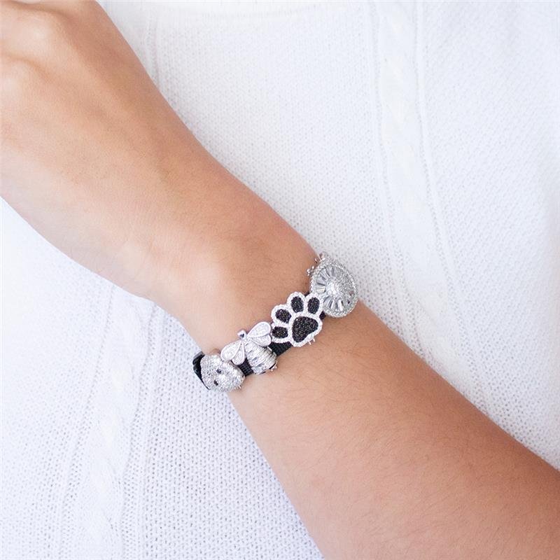 PULSEIRA ESTEIRA PRETA COM PINGENTES FOLHEADOS